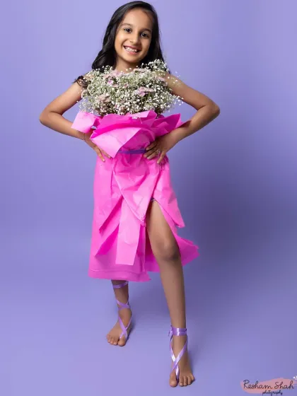 Striking a pose in her flower-bouquet dress. This creative session was so much fun and resulted in truly one-of-a-kind photographs.