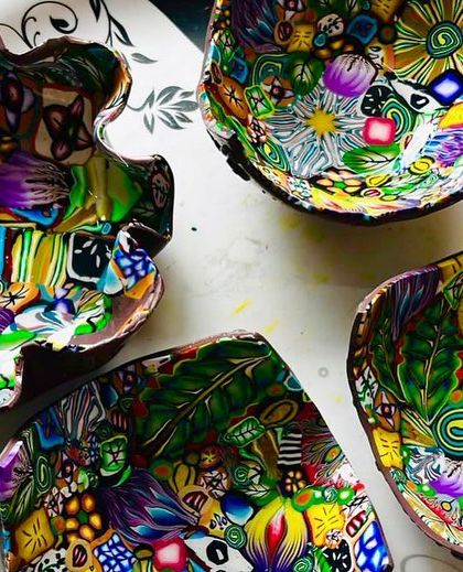 My trinket dishes made from polymer clay and resin. Each one is a small canvas where I play with clay canes to create a unique, chaotic, and colorful design.