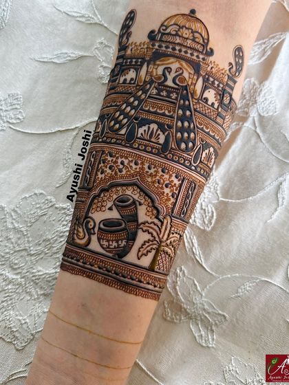 A bridal arm band design featuring traditional wedding elements like the kalash and dhol, set within a royal palace scene.