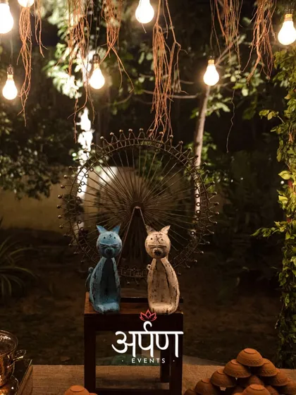 Decorative details, like these cat figurines and hanging lights, add a whimsical touch to the overall event ambiance.