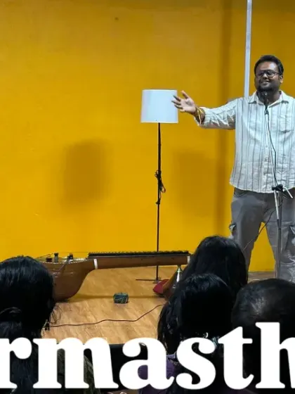 The founder of our movement, full of passion, speaking to the crowd at Karmasthan. This image captures the energy and purpose that drives our community, with our vibrant yellow wall in the background.