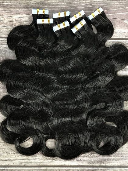 For those who love body and bounce, I have wavy tape-in extensions. This set of black, wavy extensions is made from 100% human hair and is ready to be styled.