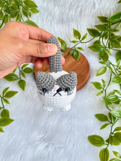 A grumpy but cute little cat plushie. I love his expressive face! This was a custom order to replicate a customer's pet, and I'm so happy with how he turned out.