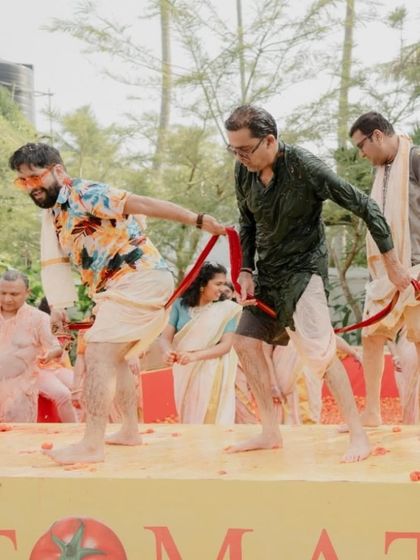 The groom's friends and family enjoying the playful chaos of the Tomatina Haldi. It’s a perfect example of how we blend tradition with completely unexpected and fun ideas.