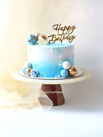 Another angle of the blue and gold sphere cake, suitable for any occasion.