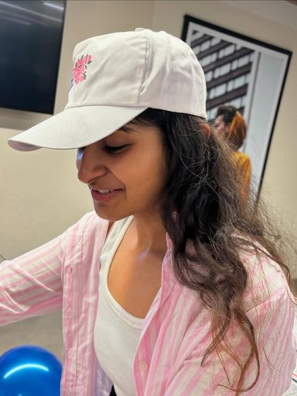 Me at the cap painting workshop. It was a heartwarming experience to guide the kids and see their excitement as they painted their own unique designs.