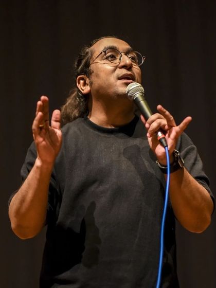 Guptaji engaging the audience with his relatable and humorous storytelling.