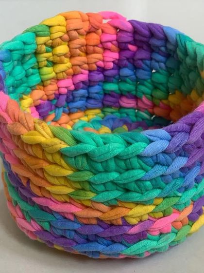 A close-up of the chunky stitches on the rainbow basket.