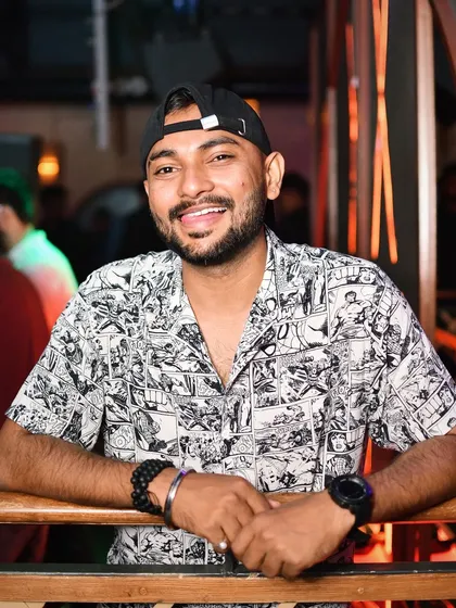 A moment of calm before the storm. While my energy is high behind the decks, I believe in staying grounded and approachable. A genuine smile and good vibes are just as important as the music.