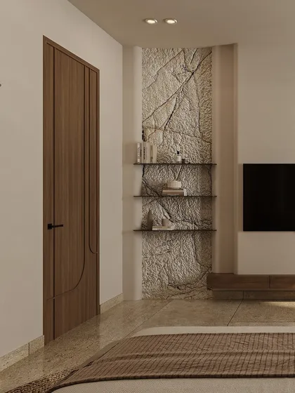 A textured stone feature wall behind the TV serves as a rustic focal point. This raw, natural element is balanced by clean lines and minimalist shelving, creating a perfect blend of warmth and modern function.