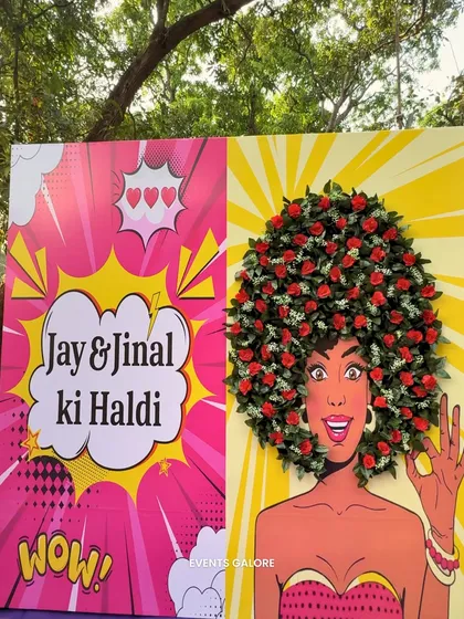 A custom Haldi photo booth with a pop-art twist. The illustration features a 3D floral afro, creating a fun and interactive spot for guests to capture memories.