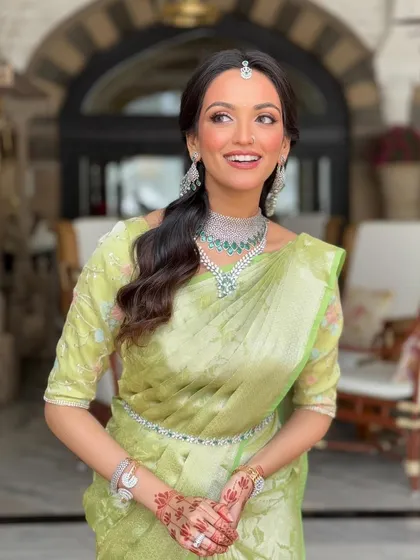 A candid, happy moment. The makeup is designed to look beautiful in motion and from every angle, ensuring the bride feels confident and radiant throughout her day.