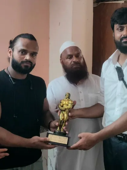 Presenting an award to a dedicated bodybuilder and martial artist. We support and celebrate strength in all its forms.