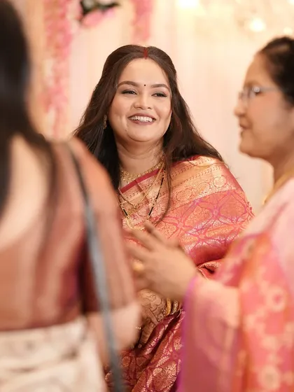 The bride interacting with guests, her smile lighting up the room.