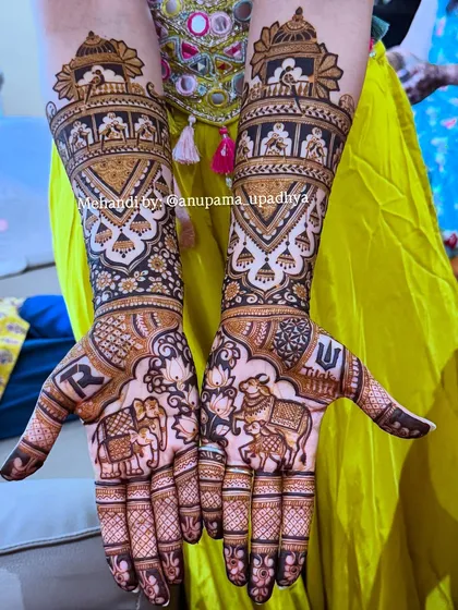 A special design for my dear niece. Her bridal mehandi features her and her groom's initials, along with auspicious symbols like the elephant and Nandi, blessing her new journey.