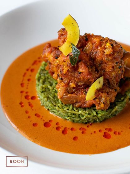 The vibrant colours of our Prawn Vepudu dish. The green of the gongura rice and the orange of the prawn curry create a visually stunning plate that is packed with bold flavours.