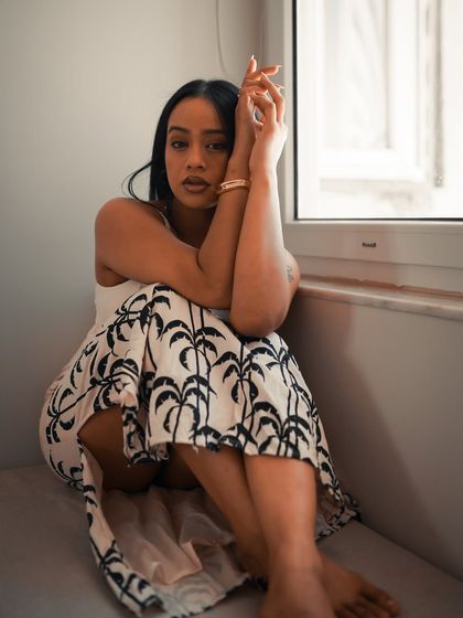 In this shot, the model looks directly at the camera, creating a powerful connection. The soft, natural light keeps the mood intimate and soulful.