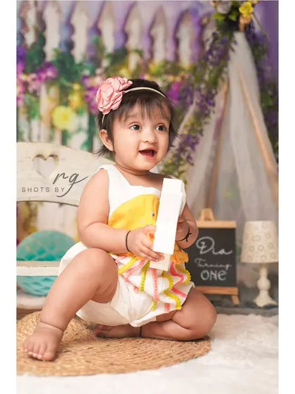 A sweet portrait of Dia turning one. We offer multiple outfit and setup changes during our birthday sessions to give you a variety of beautiful photos.