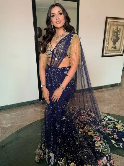 A full view of Mehak's celestial-inspired cocktail look. The sparkling details of her Rahul Mishra outfit are matched by her radiant makeup.