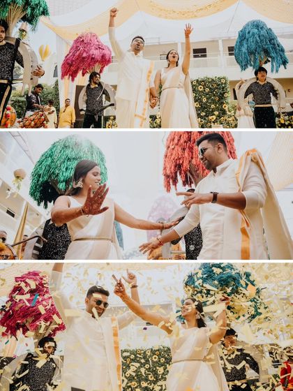 The couple makes a grand, festive entrance with dancers and a confetti shower. A moment of high energy and celebration.