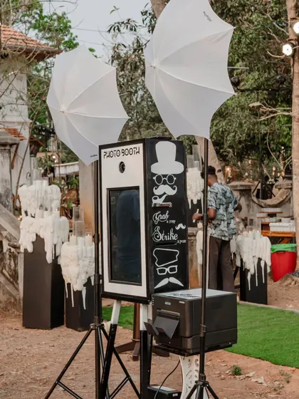 A classic photo booth with a fun, quirky design. Interactive stations like this are a great way to ensure guests have a blast and capture memories that last a lifetime.