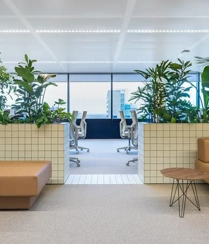 We can transform a standard office into a vibrant and healthy workspace. Here, we integrated lush greenery into custom tiled planters, using plants as natural dividers to create a calmer, more productive atmosphere for the team.