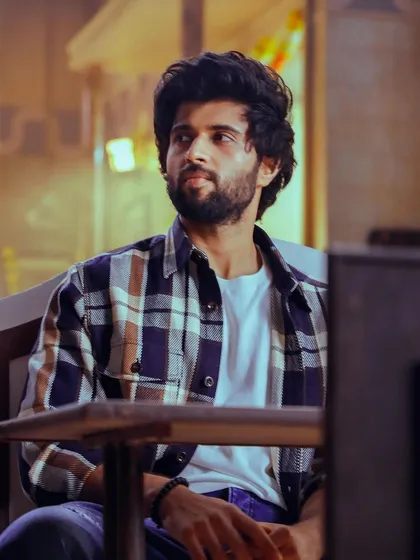 A casual moment from a Thums Up commercial with Vijay Deverakonda. I styled him in a classic plaid shirt over a white tee, creating a relatable and approachable look for this scene.