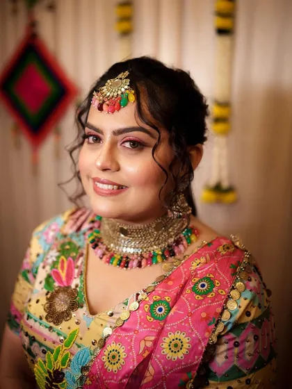 A close-up of my signature Haldi makeup look. I used a bright pink eyeliner and shimmering eyeshadow to create a look that is both vibrant and glamorous.