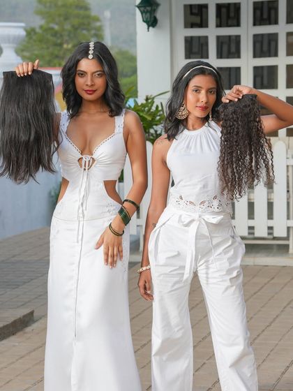 We offer extensions in all textures. Here, two models showcase our straight and curly hair extensions, proving we have a perfect match for every hair type.