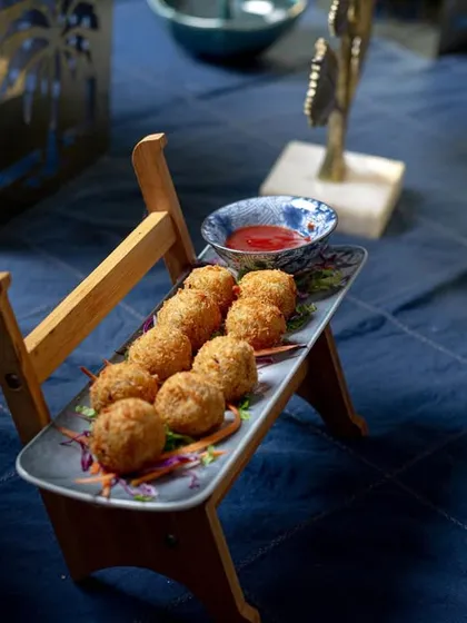 My popular cheese balls, filled with gooey cheese and served hot and fresh with a sweet chili dip. They are a guaranteed hit at any party.
