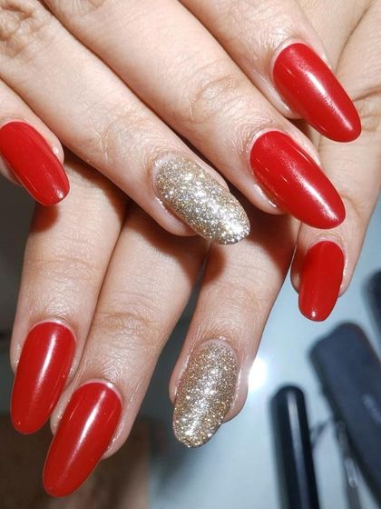 A close up of these stunning red and gold bridal extensions. The combination of bold color and sparkle is always a winner for weddings.