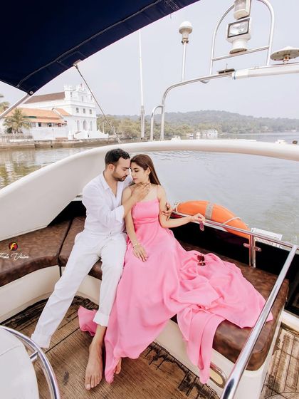 A romantic portrait of the couple on their private yacht. The beautiful Goan coastline and old churches in the background add a unique sense of place to their pre wedding story.