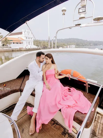 A romantic portrait of the couple on their private yacht. The beautiful Goan coastline and old churches in the background add a unique sense of place to their pre wedding story.