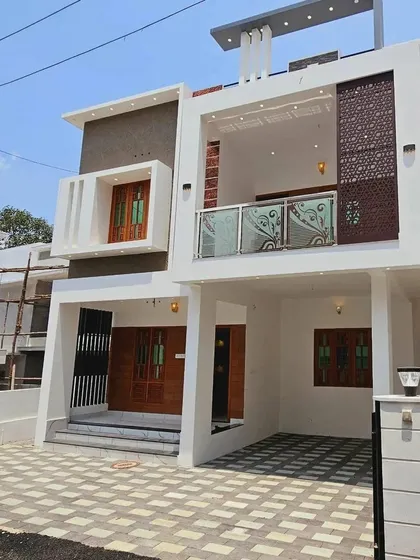 This modern home design features clean lines and a minimalist aesthetic, with decorative screen panels on the upper floor for added privacy and visual interest. The layout includes a covered carport and a welcoming entryway.