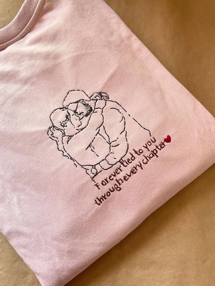 Another angle of the 'Forever tied to you' sweatshirt. The delicate lettering underneath the line art adds another layer of personalization.