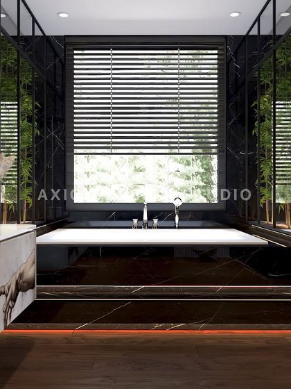 A freestanding bathtub is set against a large window, with bamboo plants adding a touch of nature. The space is designed to be a refined, modern sanctuary.