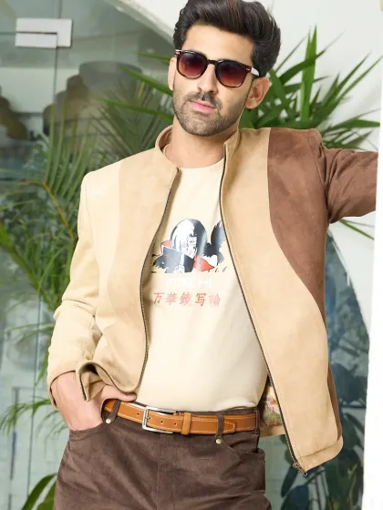 The two-toned suede jacket is a perfect example of modern, neutral fashion. Its smooth texture and unique paneling make it a standout piece for any season.