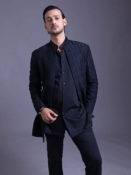 A closer look at the textured jacket, showing how it can be styled for a confident, modern, and detail-oriented look.