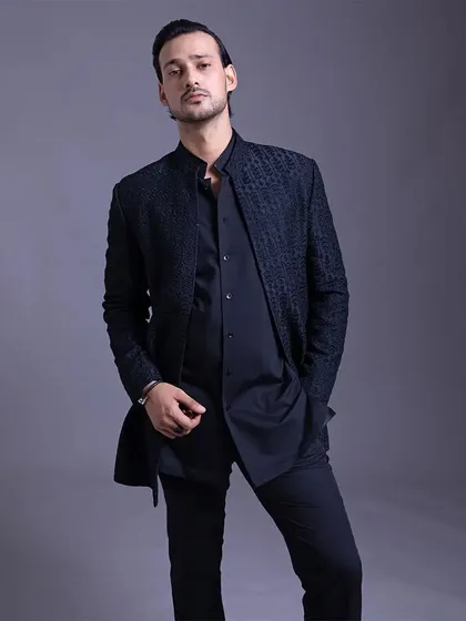 A closer look at the textured jacket, showing how it can be styled for a confident, modern, and detail-oriented look.