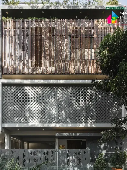 The full front elevation of the '10 x 10 Residence', showcasing the layered facade with its intricate 'jaali' and wood screens.