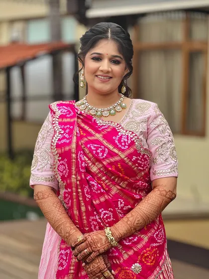 A happy portrait of the bride, her makeup looking fresh and radiant for the daytime event.