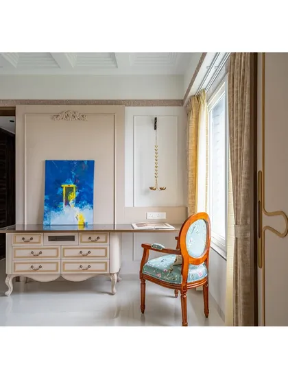The elegant study area is complemented by a piece of modern abstract art, showing how we love to mix classic and contemporary elements to create a unique, personal space.