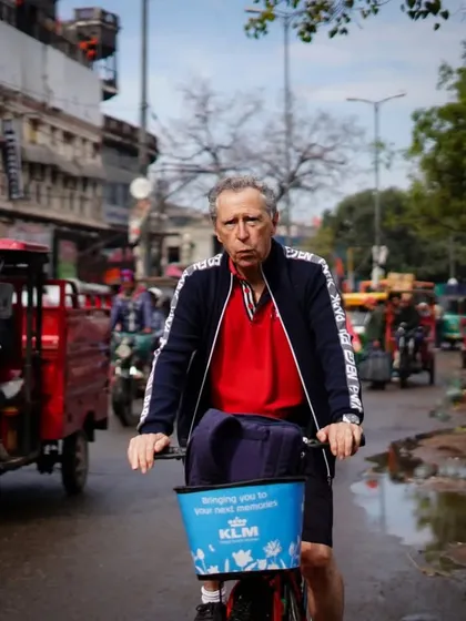Age is just a number on our tours. This gentleman confidently navigates the streets of Delhi, proving that adventure has no age limit.