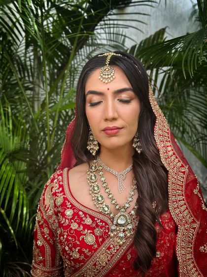 A close-up portrait, her expression calm and her makeup looking absolutely flawless.