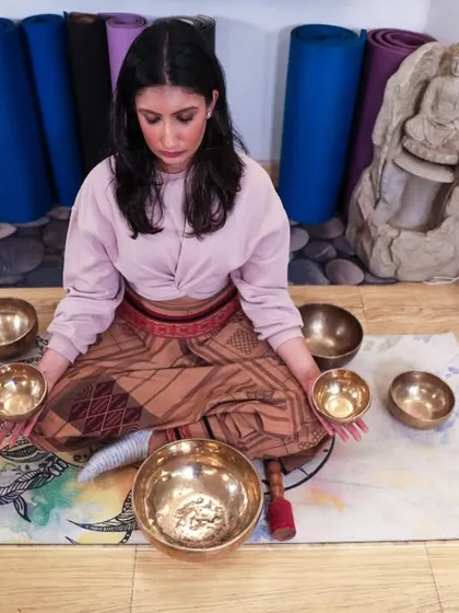 Surrounded by my Tibetan bowls, each with its own unique frequency. In my sessions, I intuitively select the right bowls to address your specific needs, creating a personalized soundscape for your healing journey.