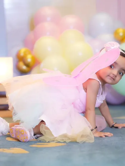 A candid crawling shot of our little fairy. I capture children in motion to show their playful energy and natural movements during a themed shoot.
