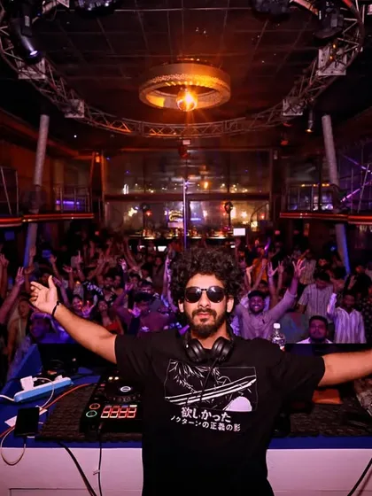 Commanding the stage at Cafe Mambo. My goal is to create a unified experience where the music and the crowd become one. This is the result of tracks built and tested for a packed house.