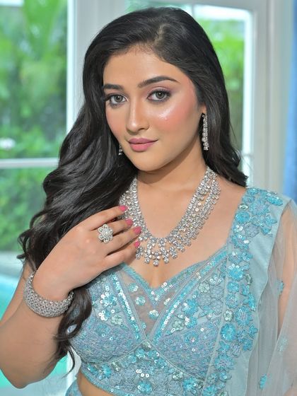 This shot highlights the complete set, including the bracelet and ring, which adds to the cohesive and polished look.