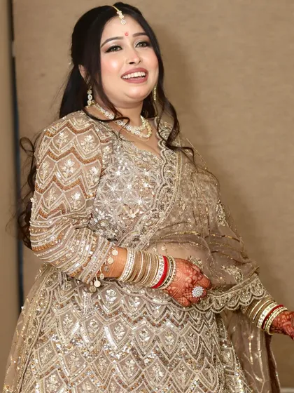 The perfect "Din Shagna Da" moment. A candid shot of the bride's happy smile, showcasing her glowing HD engagement makeup.