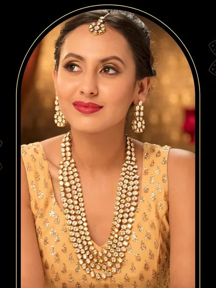 This round Polki Kundan opera-length long necklace set is a statement in itself. It's perfect for wearing over a simple blouse for a pre-wedding event or for layering with a choker.